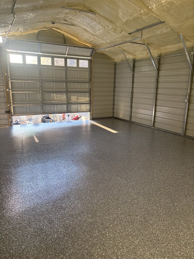 Steel building interior with a finished flake floor